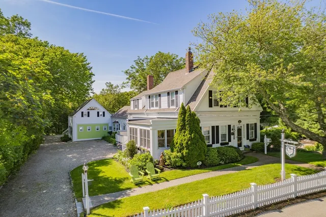 a front view of a house with swimming pool yard and outdoor seating