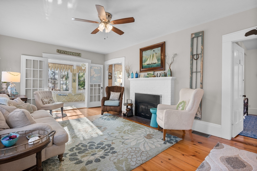 436 South Main Street Barnstable, MA 02632 - Photo 11 of 42 a living room with furniture and a fireplace