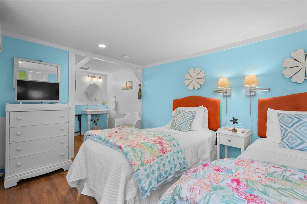 436 South Main Street Barnstable, MA 02632 - Photo 24 of 42 a bedroom with two beds and a flat screen tv