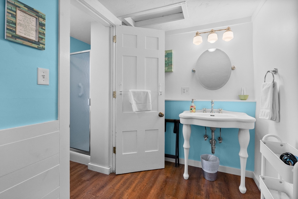 436 South Main Street Barnstable, MA 02632 - Photo 26 of 42 a bathroom with a sink mirror and tub