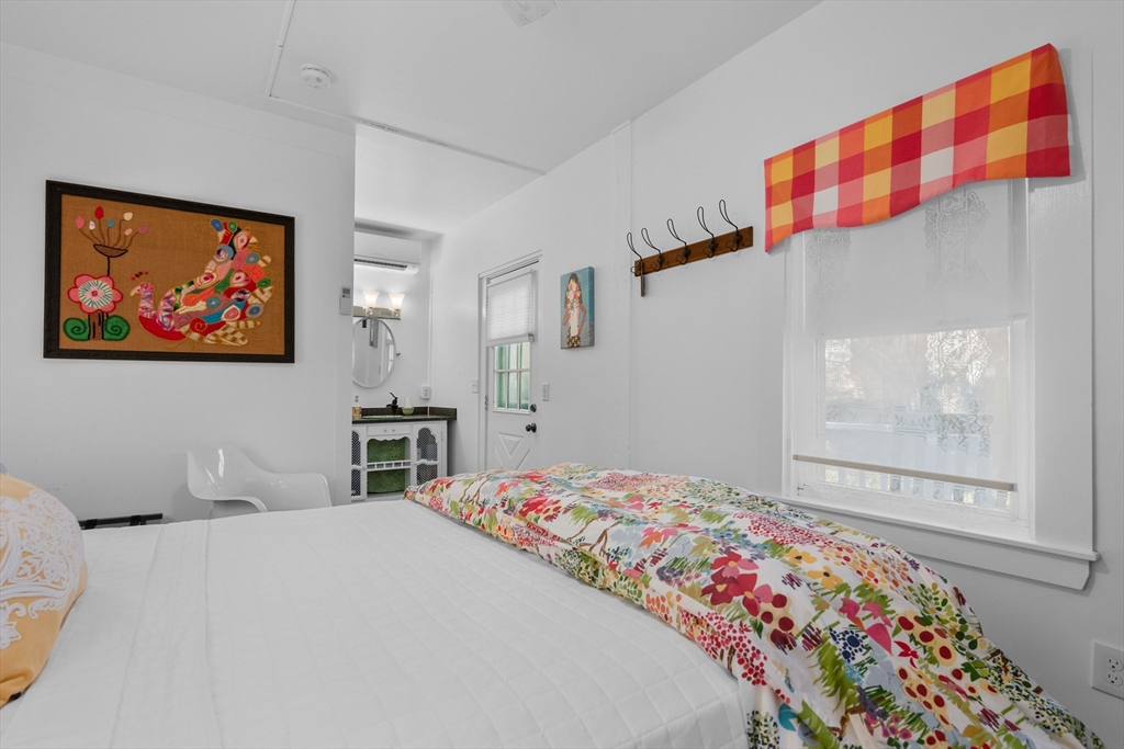 436 South Main Street Barnstable, MA 02632 - Photo 28 of 42 a bedroom with a bed and a painting on the wall