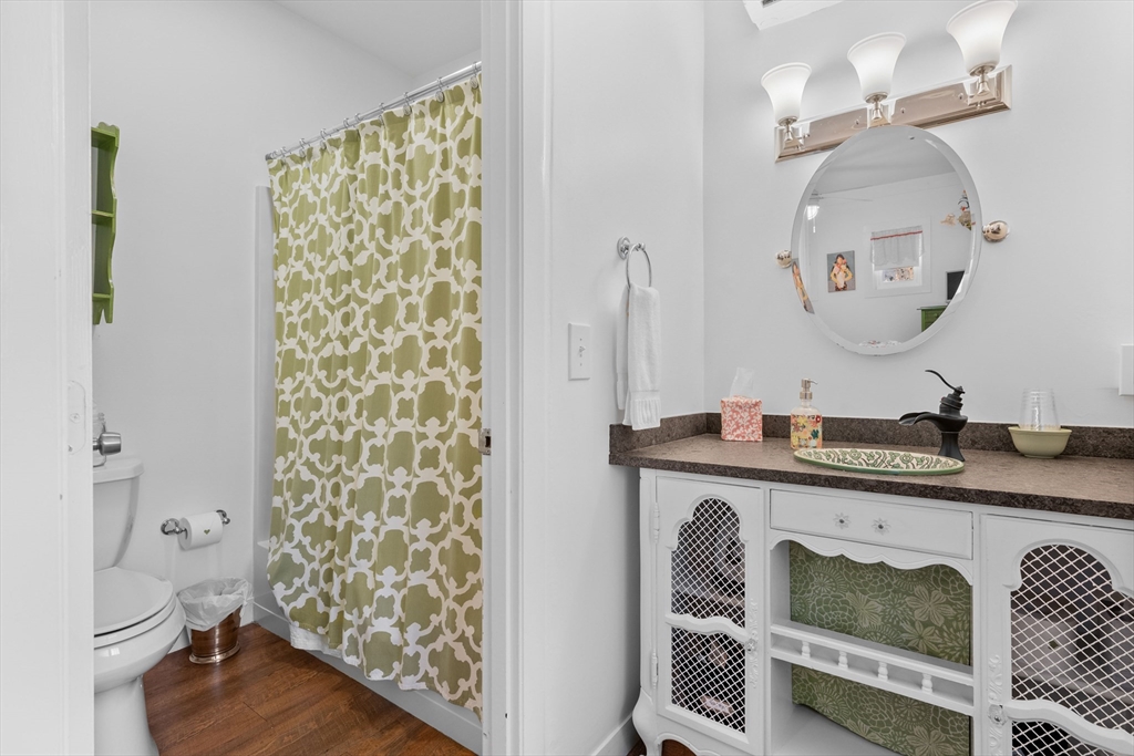 436 South Main Street Barnstable, MA 02632 - Photo 29 of 42 a bathroom with a granite countertop sink and a mirror