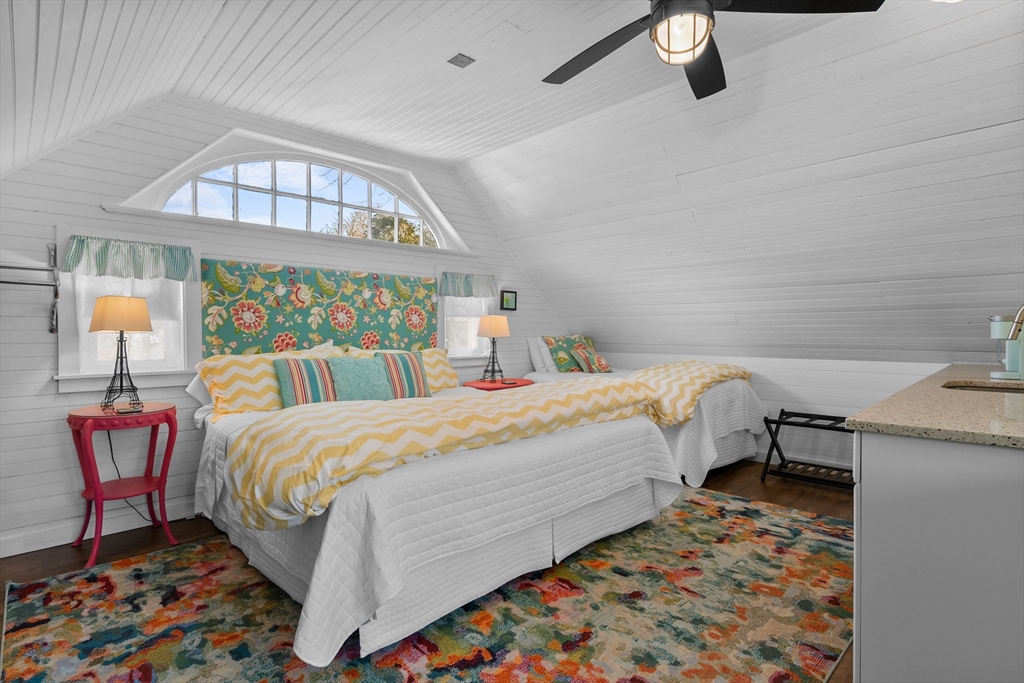 436 South Main Street Barnstable, MA 02632 - Photo 31 of 42 a bedroom with a bed and a chandelier