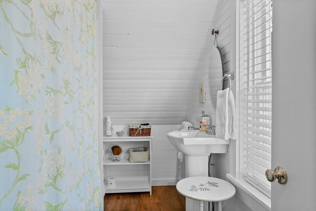 436 South Main Street Barnstable, MA 02632 - Photo 33 of 42 a bathroom with a sink and a mirror