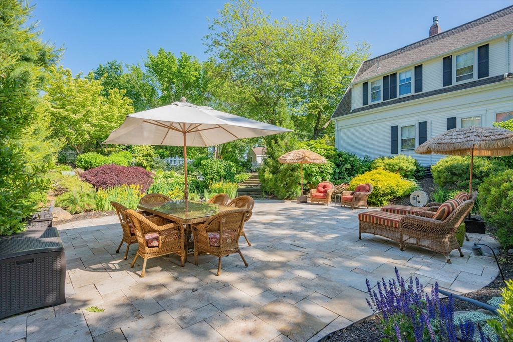 436 South Main Street Barnstable, MA 02632 - Photo 34 of 42 a patio with a patio table and chairs
