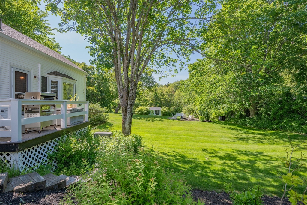 436 South Main Street Barnstable, MA 02632 - Photo 38 of 42 a view of backyard with table and chairs and potted plants