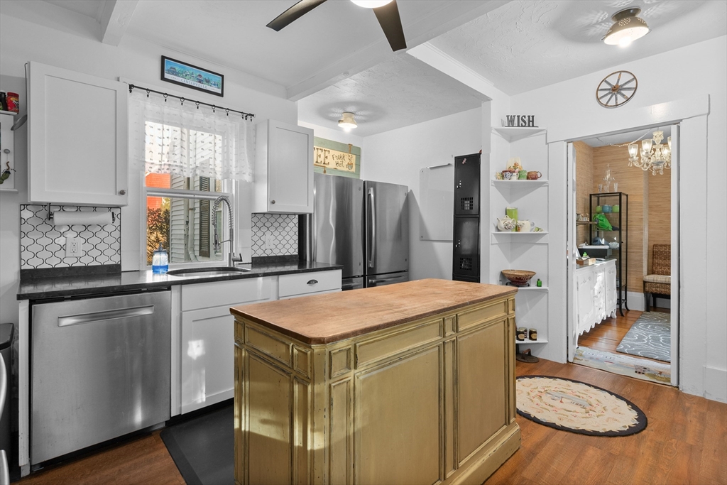 436 South Main Street Barnstable, MA 02632 - Photo 5 of 42 a open kitchen with a sink stove and refrigerator