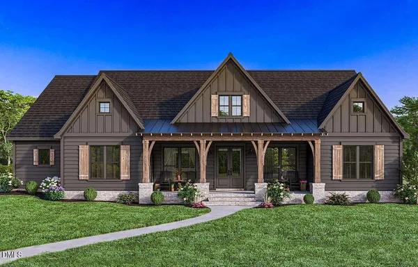 a front view of a house with a garden and porch