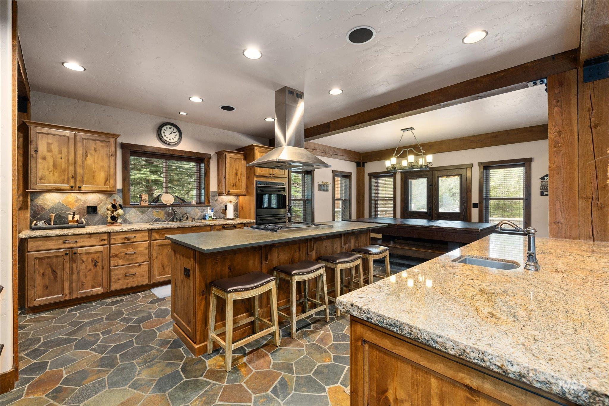 14 Pointe At Goldfork Court Donnelly, ID 83615 - Photo 13 of 49 Kitchen featuring wood-finish cabinetry, stone flooring, and recessed lighting