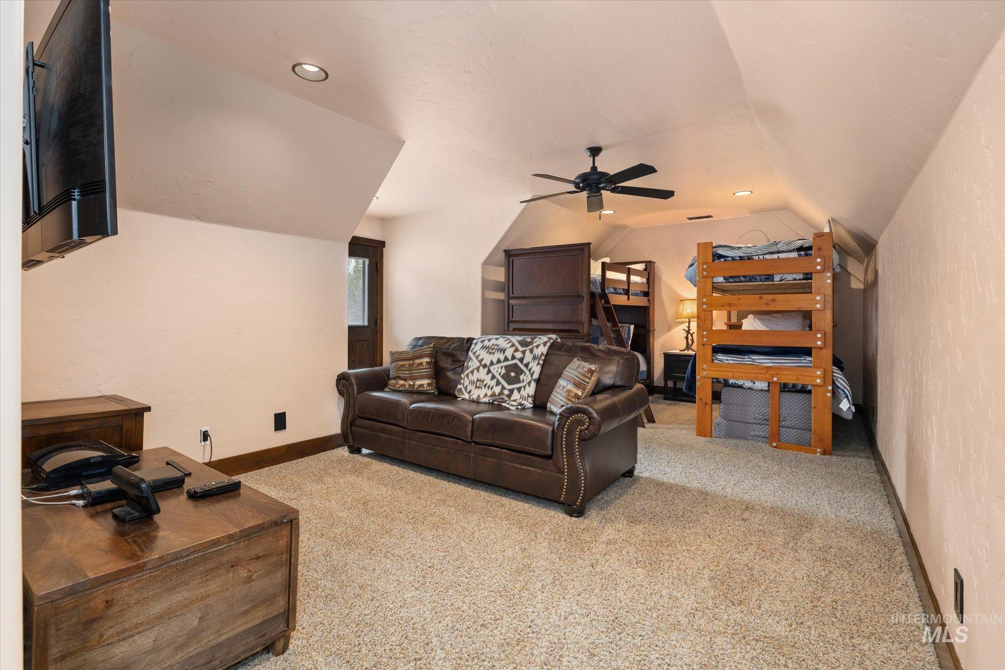 14 Pointe At Goldfork Court Donnelly, ID 83615 - Photo 26 of 49 Carpeted room with sloped ceilings, recessed lighting, and a ceiling fan