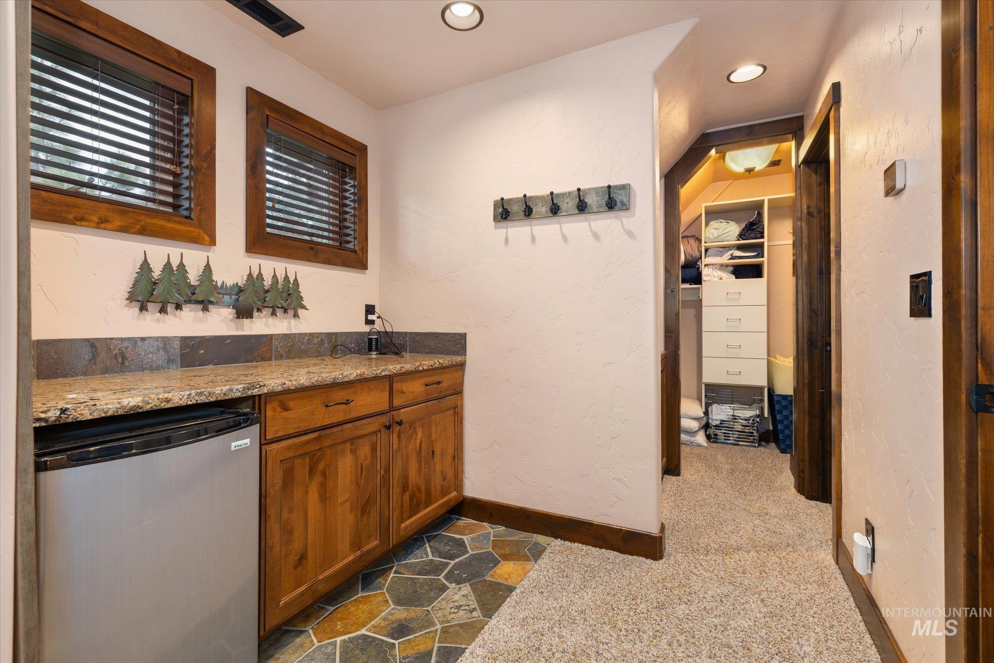 14 Pointe At Goldfork Court Donnelly, ID 83615 - Photo 28 of 49 Built-in cabinetry with granite-style countertops and a tile backsplash