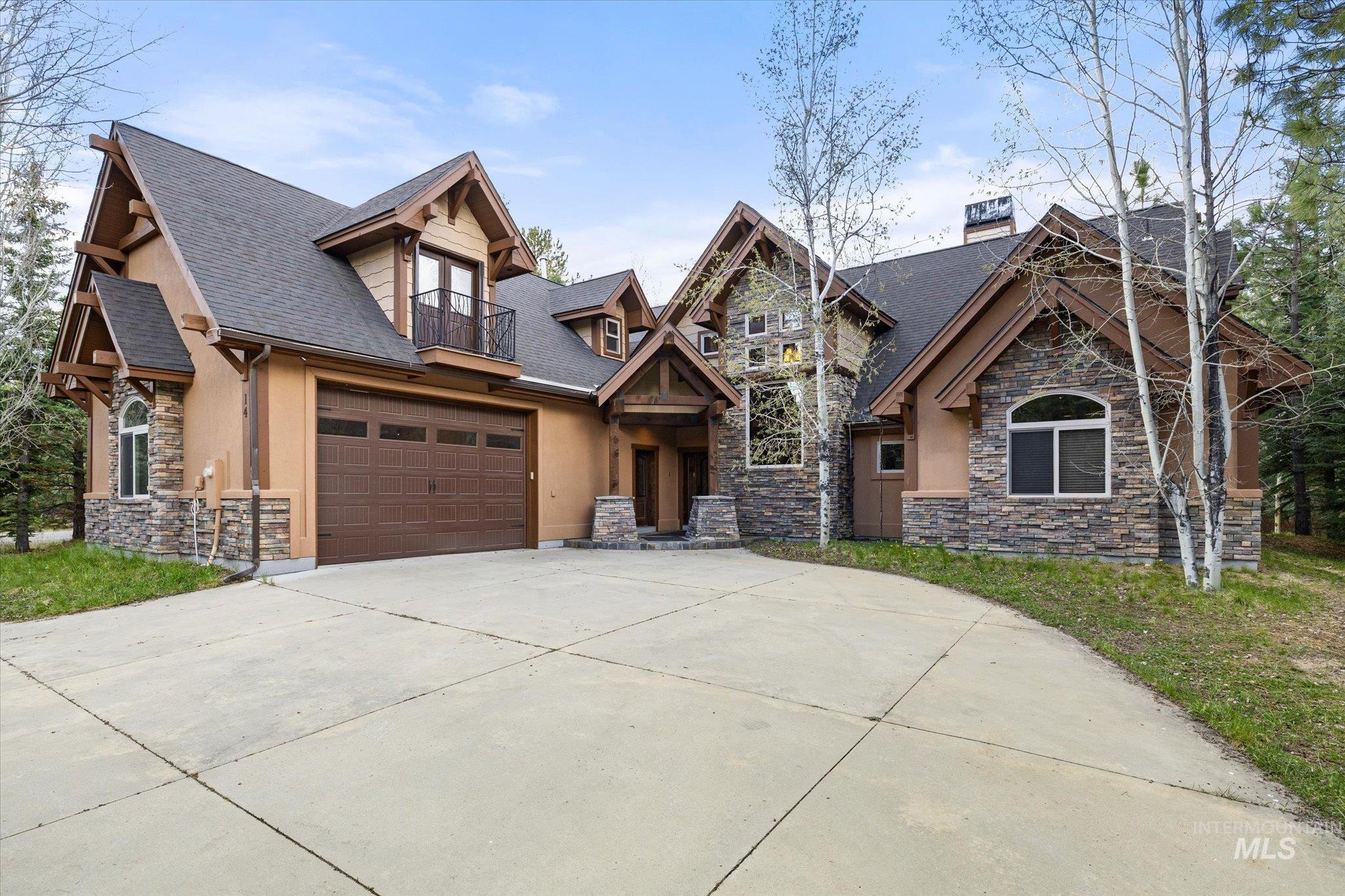 14 Pointe At Goldfork Court Donnelly, ID 83615 - Photo 42 of 49 Stone and stucco exterior with multiple gables and dark trim details