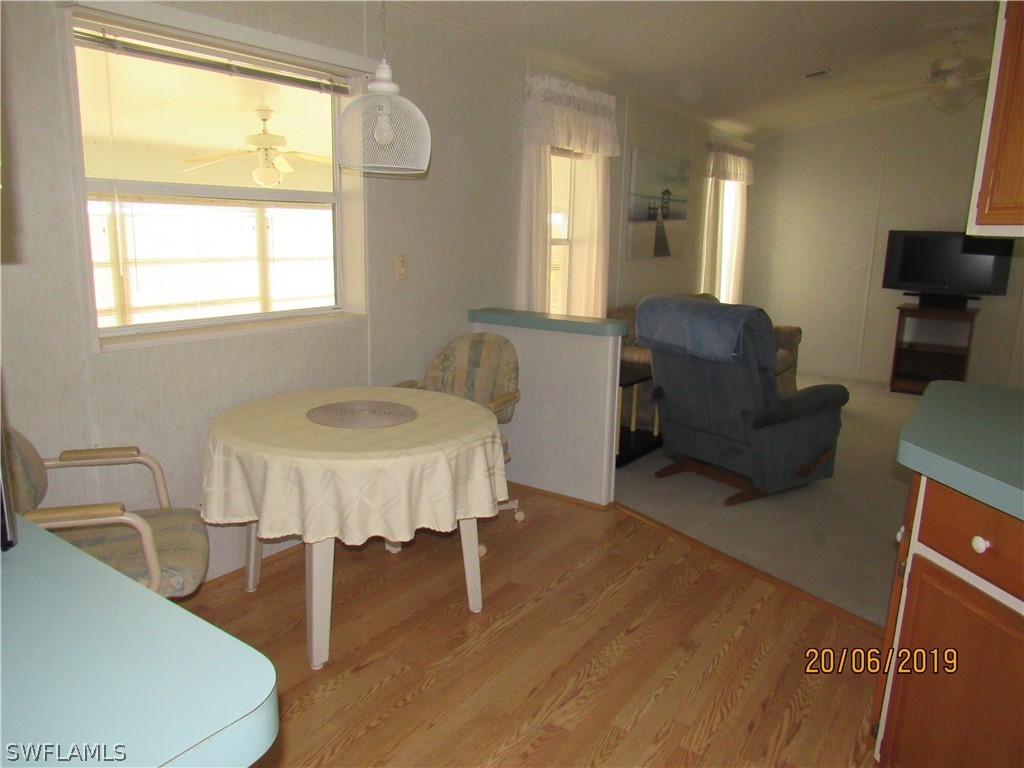 7695 Carpenter Road Bokeelia, FL 33922 - Photo 8 of 26 a living room with furniture and a window