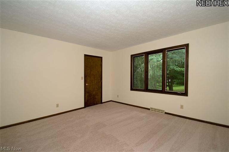 2610 Addyston Road Akron, OH 44313 - Photo 14 of 20 Bedroom 3 - 13x13 located at the rear of home, it features fresh paint, new carpet and a great view of the private backyard