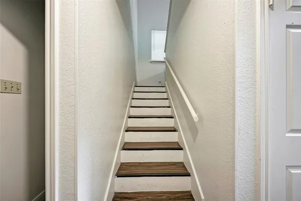 a bed room with a bed and a chandelier