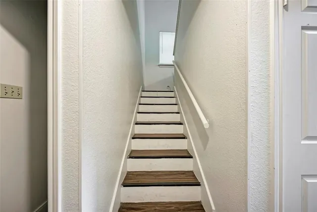 a bed room with a bed and a chandelier