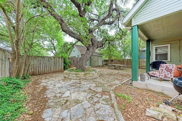 a view of a backyard with a patio and entertaining space
