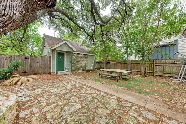a view of a backyard with a trees