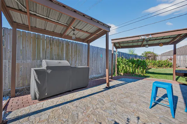 a view of a backyard with wooden floor