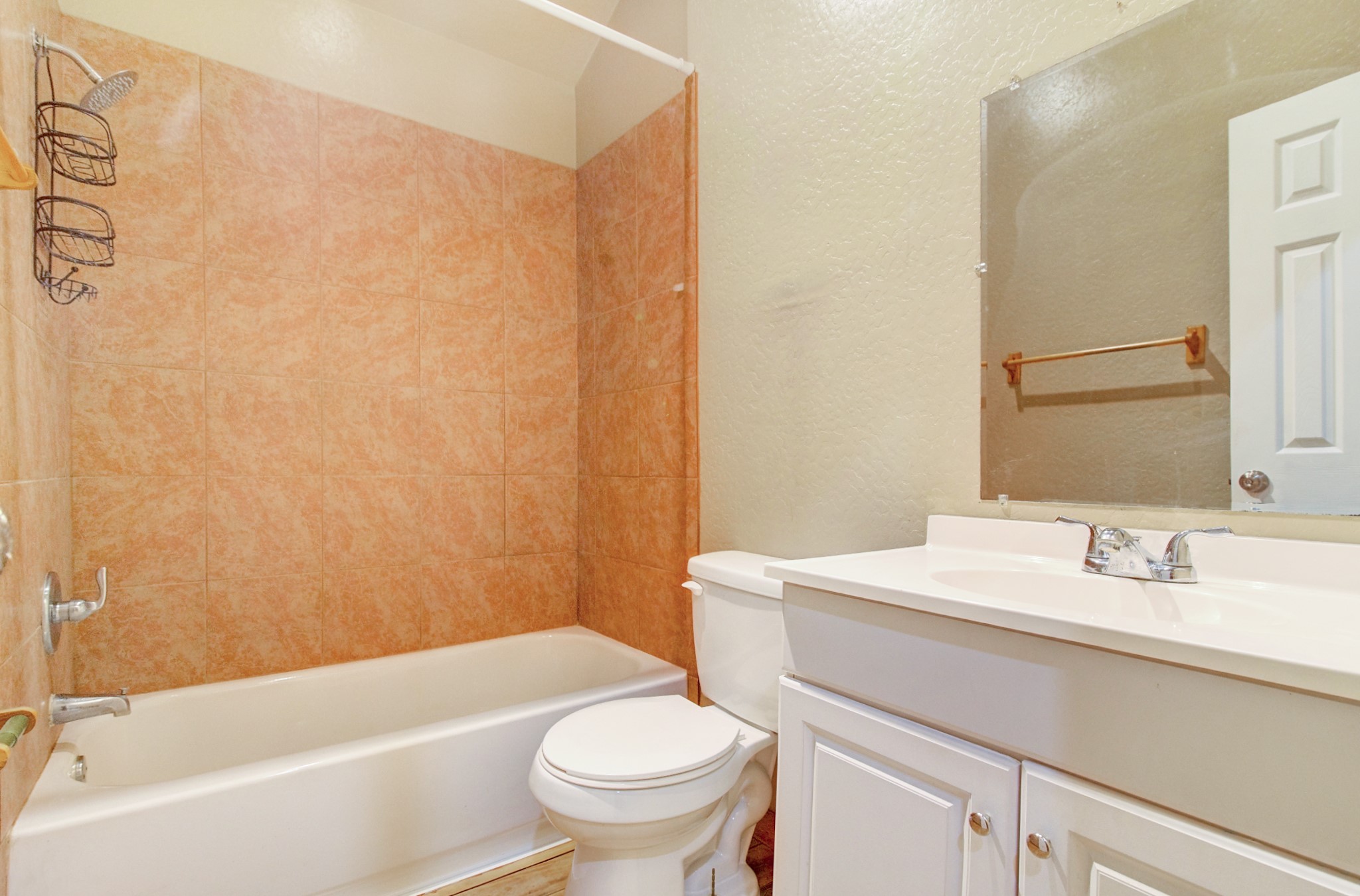 10521 Tanyard Road, Unit SM Willis, TX 77378 - Photo 9 of 11 The bathroom offers storage space for your toiletries and there is a standard tub/shower combo.