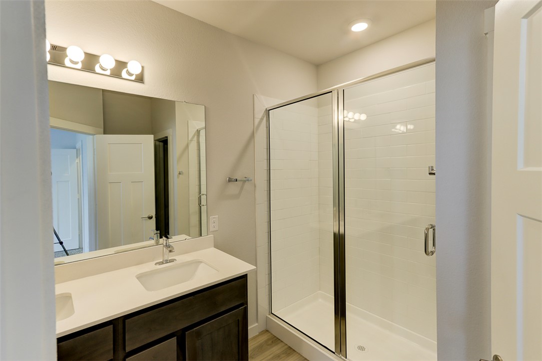 760 Double Mountain Road College Station, TX 77845 - Photo 12 of 26 a bathroom with a sink and a mirror