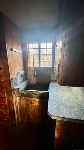 a view of a kitchen with furniture and a window
