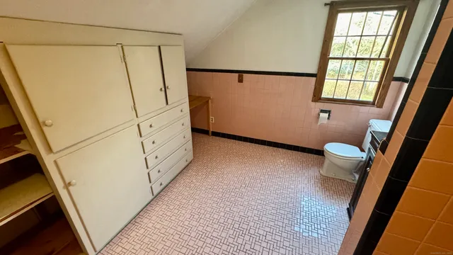a bathroom with a tub and shower