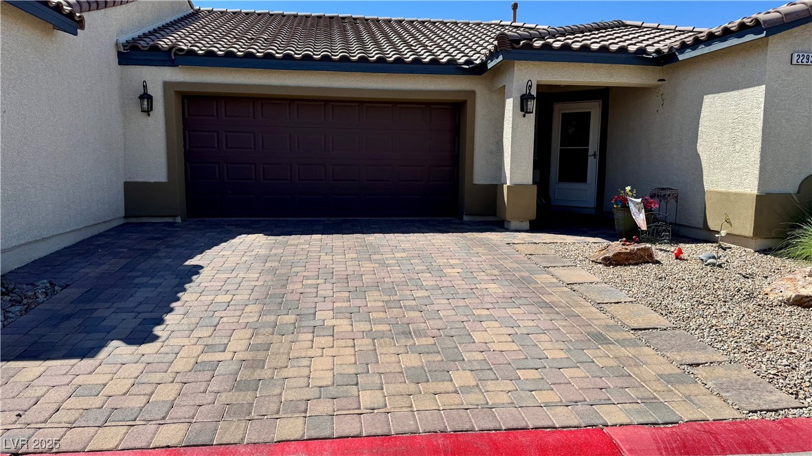2293 Chandler Ranch Place Laughlin, NV 89029 - Photo 4 of 23 Garage featuring decorative driveway