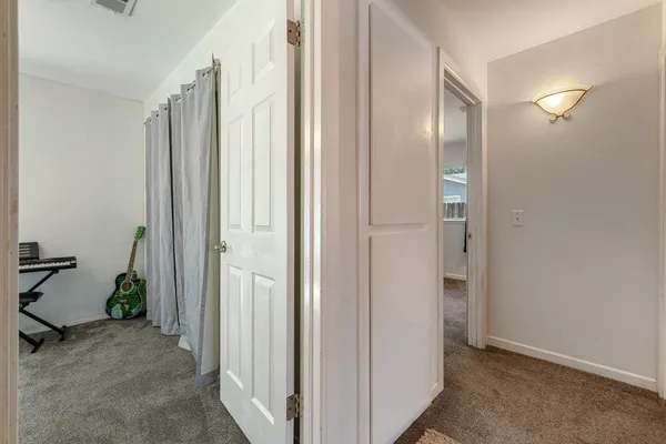a view of hallway with livingroom