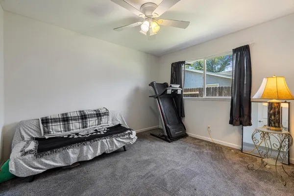 a bedroom with furniture and a chandelier