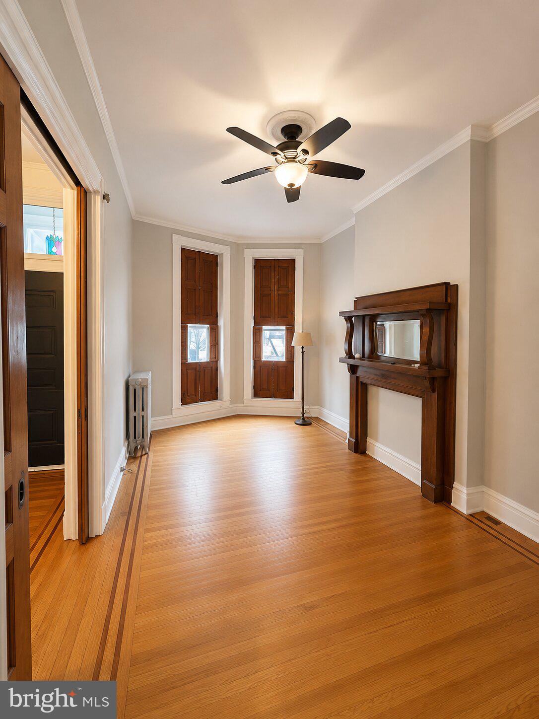 1908 Madison Avenue Baltimore, MD 21217 - Photo 4 of 31 a view of an empty room with wooden floor and a window