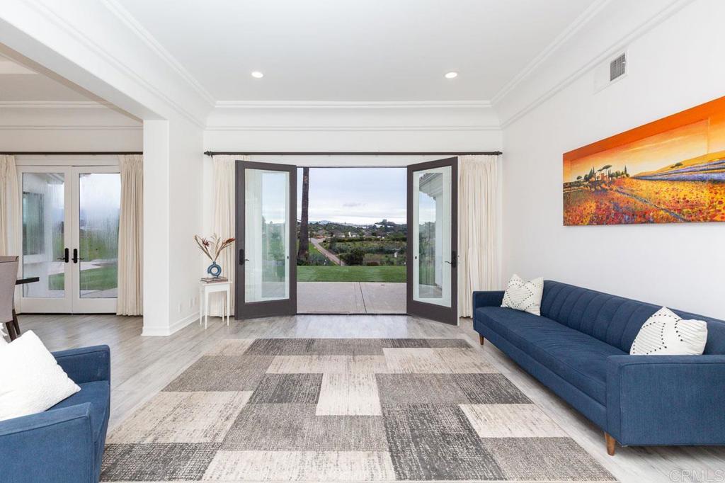 9650 Covey Lane Escondido, CA 92026 - Photo 15 of 39 a living room with a large window and a couch