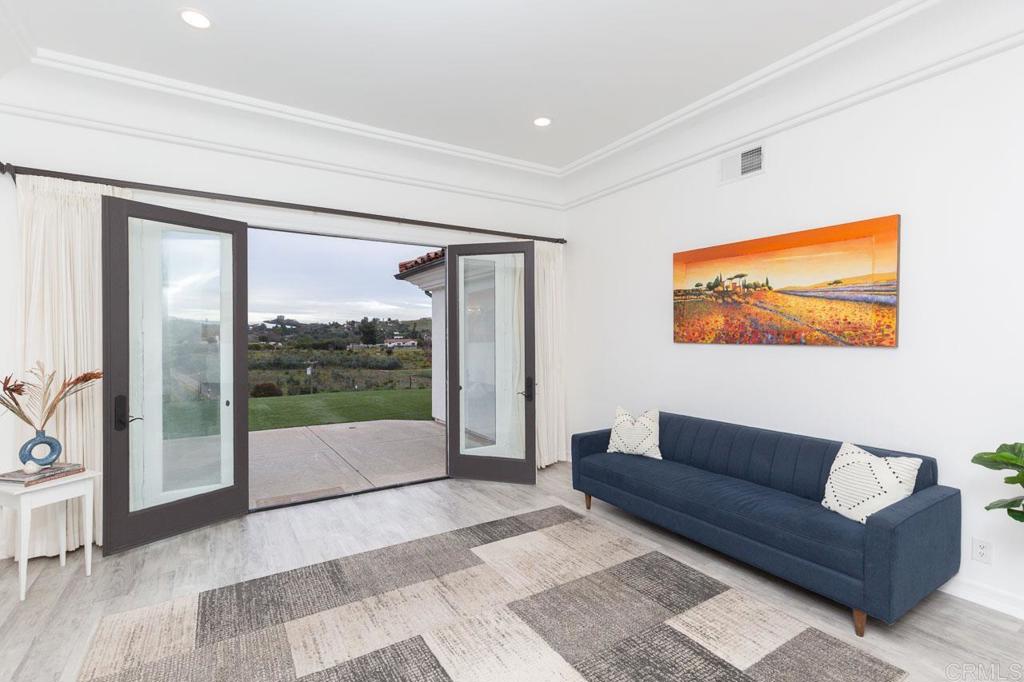 9650 Covey Lane Escondido, CA 92026 - Photo 16 of 39 a living room with furniture and a flat screen tv