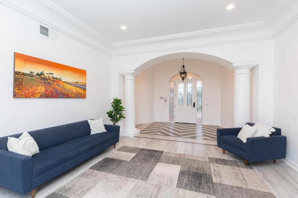 9650 Covey Lane Escondido, CA 92026 - Photo 18 of 39 a living room with furniture and a chandelier