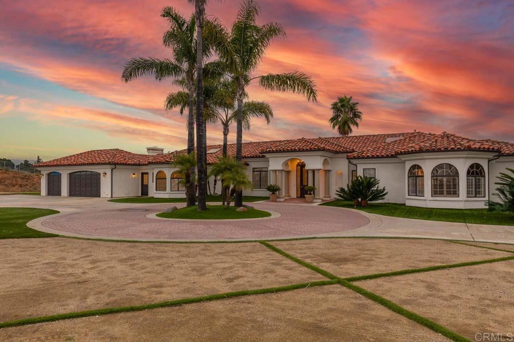 9650 Covey Lane Escondido, CA 92026 - Photo 2 of 39 a front view of a house with a garden and yard