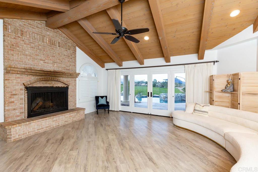 9650 Covey Lane Escondido, CA 92026 - Photo 24 of 39 a large bedroom with a bed and a fireplace