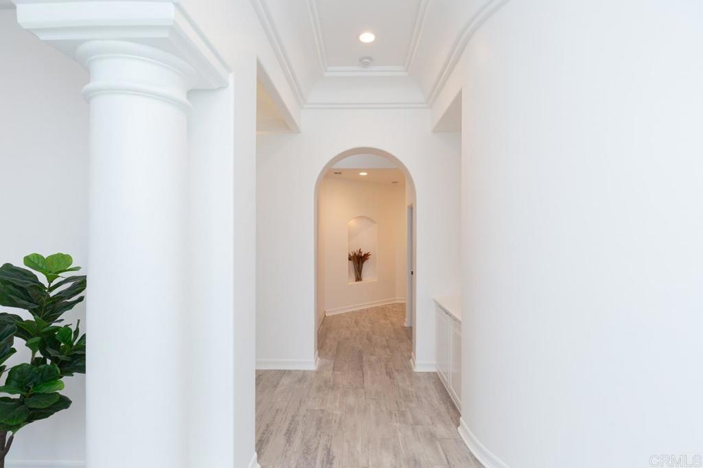 9650 Covey Lane Escondido, CA 92026 - Photo 25 of 39 a view of a hallway with wooden floor