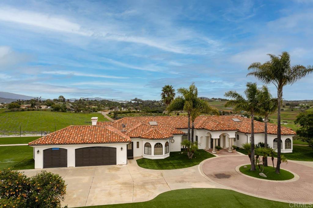 9650 Covey Lane Escondido, CA 92026 - Photo 4 of 39 a front view of a house with garden