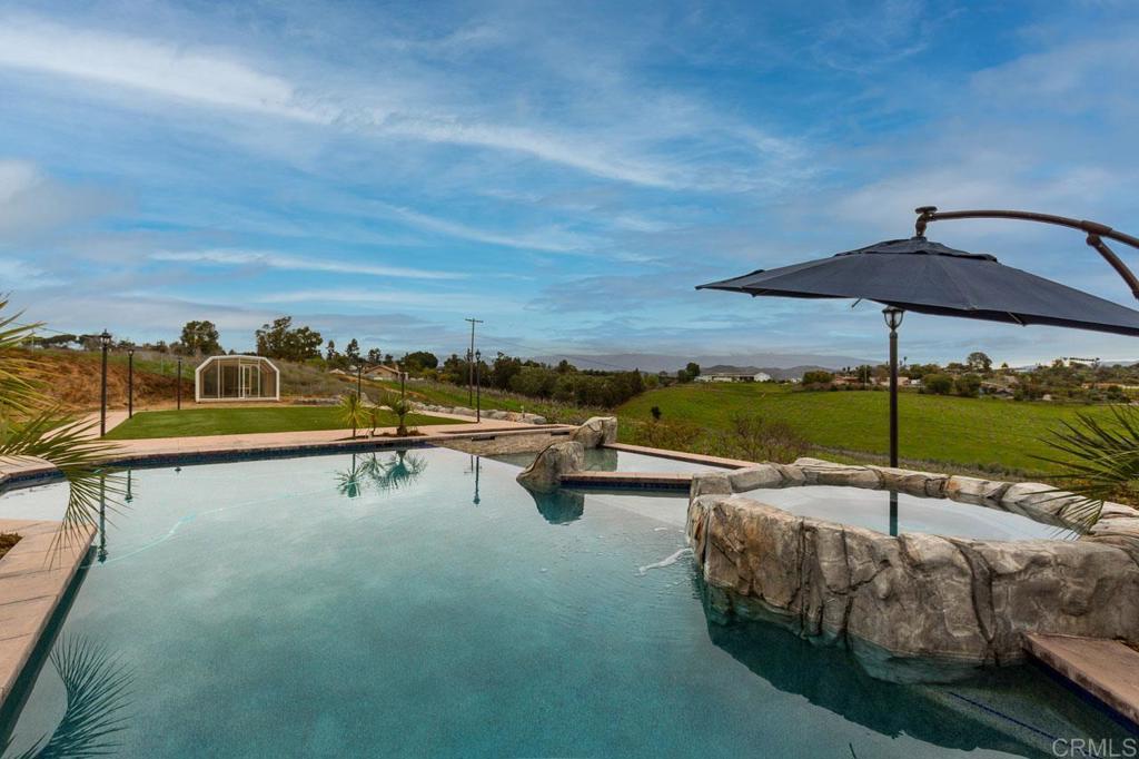 9650 Covey Lane Escondido, CA 92026 - Photo 7 of 39 an outdoor space with furniture and umbrella