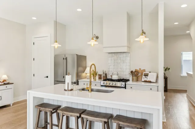 a dining room with furniture and wooden floor