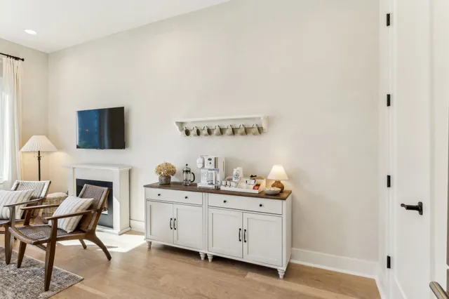 a backyard of a house with table and chairs