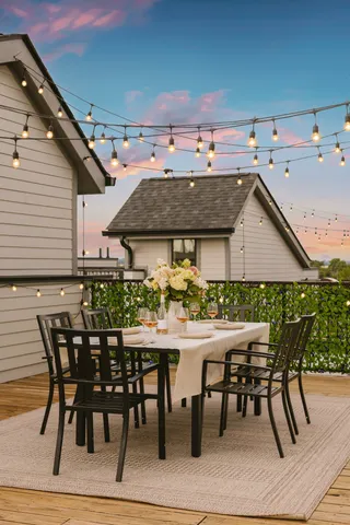 a bedroom with a bed and painting on the wall