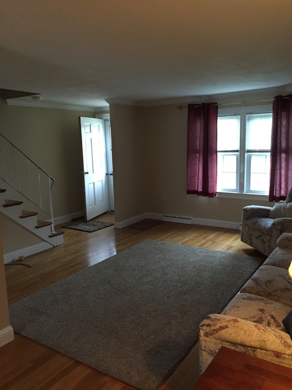 31 Clough Road, Unit 31 Dedham, MA 02026 - Photo 3 of 3 a living room with furniture and a window