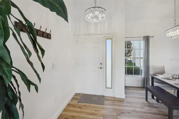 a view of an entryway with wooden floor