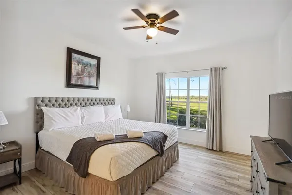 a bedroom with bed and window