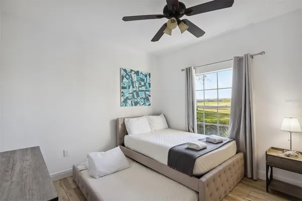 a bedroom with a bed and a window