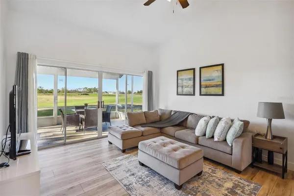 a living room with furniture and a large window