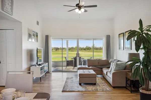 a living room with furniture and a large window