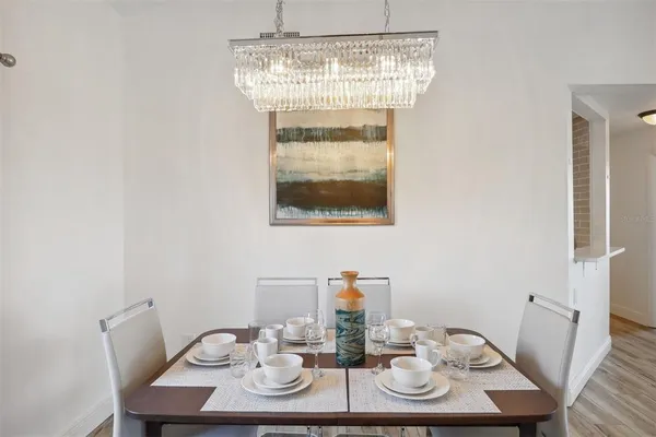 a view of a dining room with furniture and wooden floor
