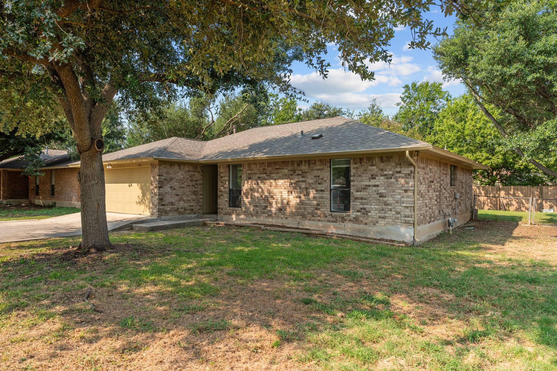 1802 Dixie Lane Round Rock, TX 78664 - Photo 14 of 30 a front view of a house with a garden